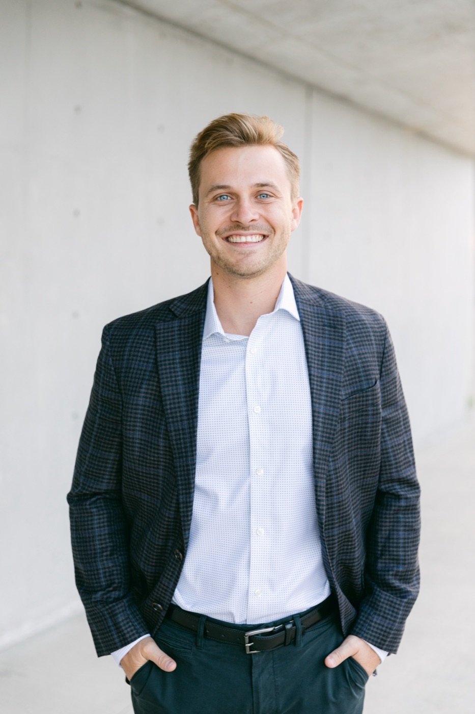 Rick Hayley smiling, wearing a navy plaid blazer